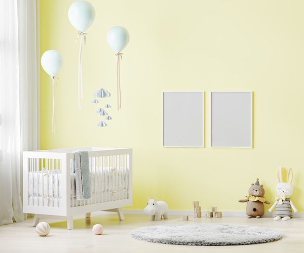pale yellow painted baby room